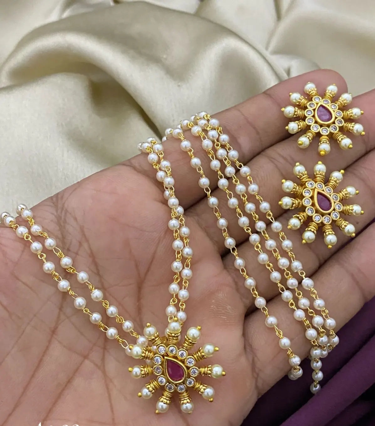 DELICATE RED, KUNDAN & PEARLS PENDENT SETS
