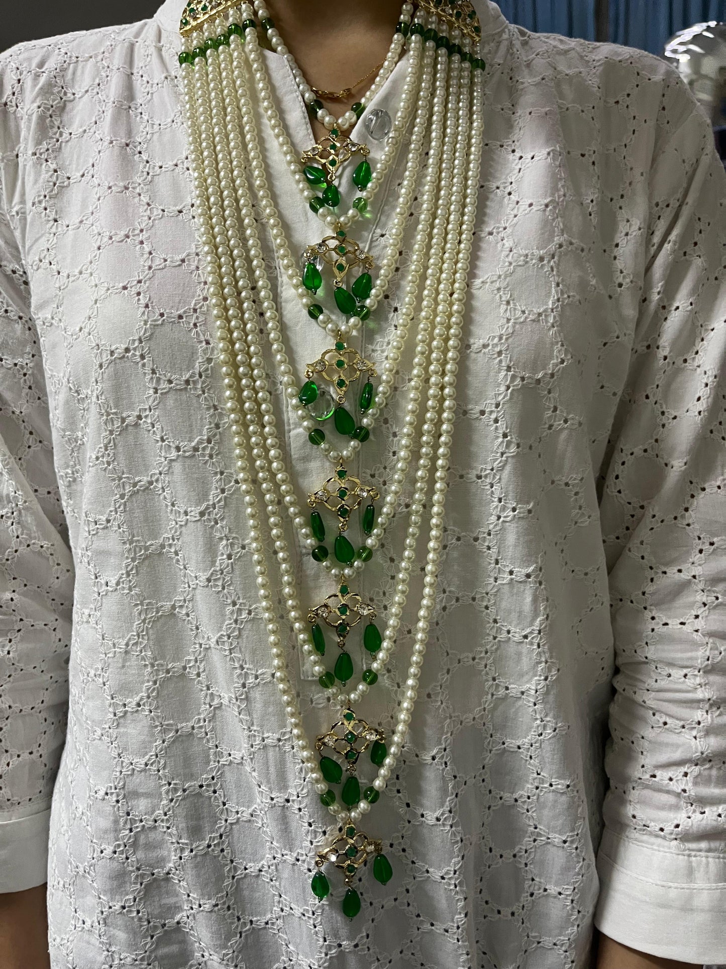 SEVEN LARI HAAR IN GREEN & PEARLS WITH JHUMKAS