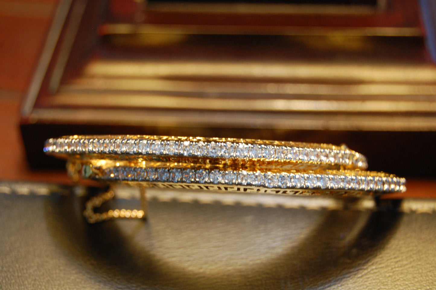 PAIR OF OPENABLE ZIRCON BANGLES