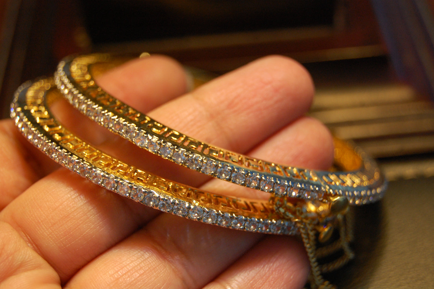 PAIR OF OPENABLE ZIRCON BANGLES