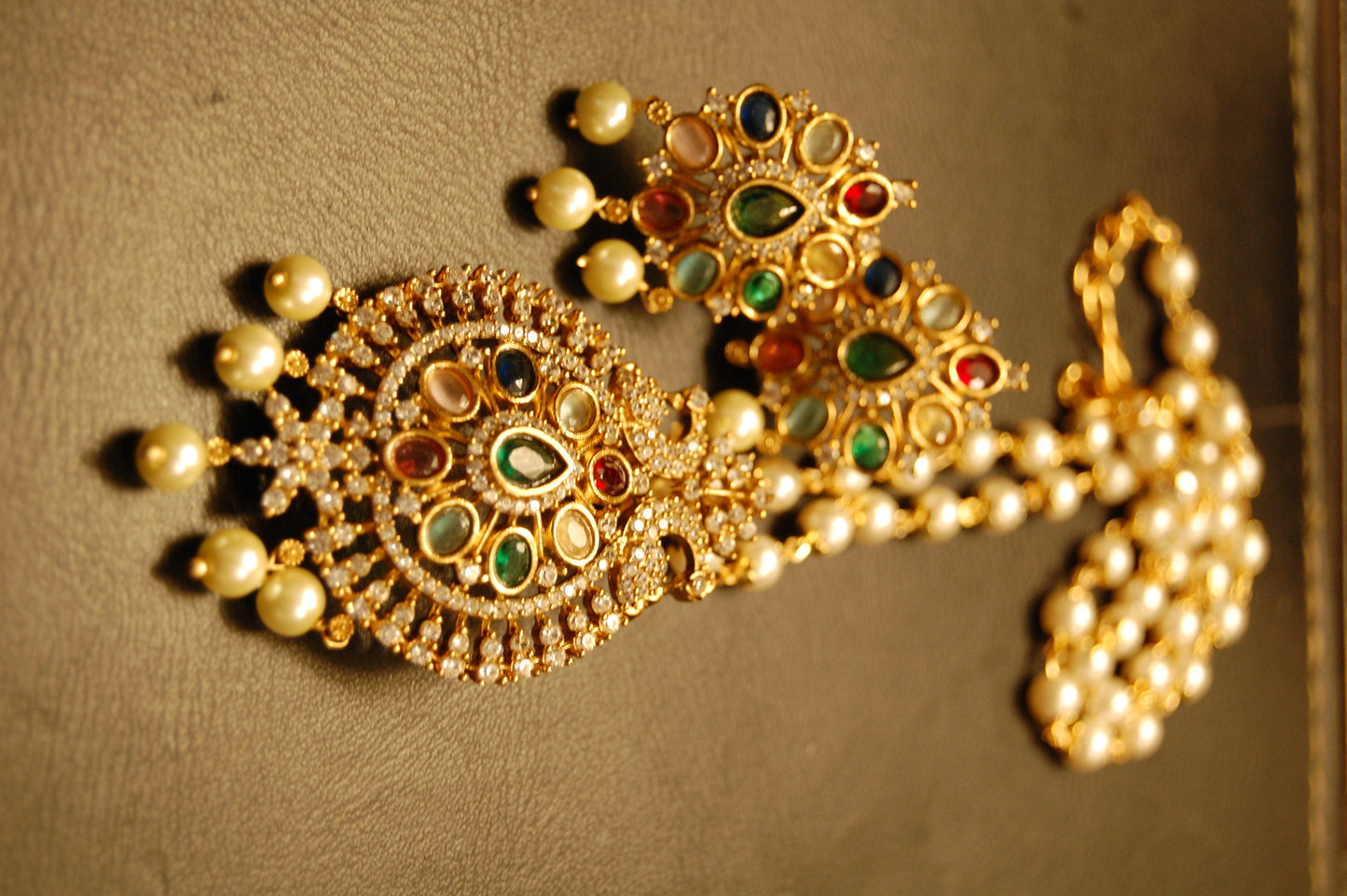 INDIAN MULTI JEWELLED PENDENT IN PEARL STRING