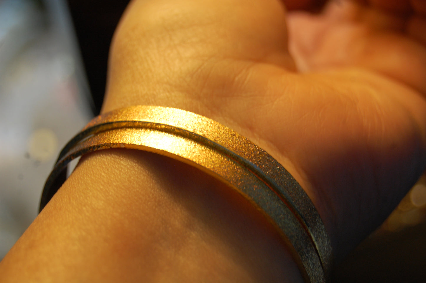 PAIR OF ELEGANT DULL GOLD BANGLES