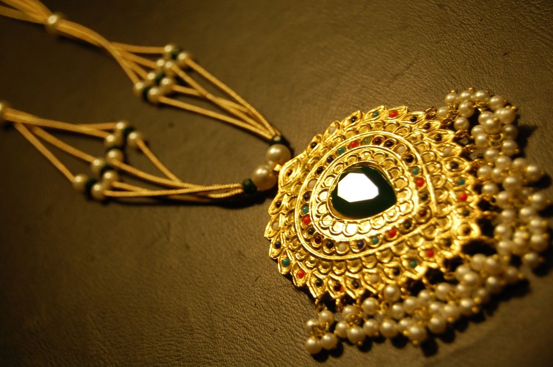 NAURATAN MALA WITH GREEN STONE