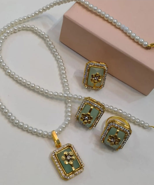 FLORAL PENDENT SET IN SOFT GREEN WITH ADJUSTABLE RING