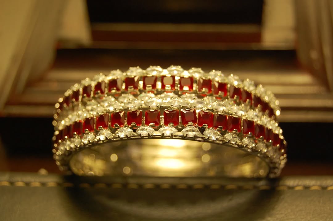 PAIR OF RED & ZIRCON BANGLES IN SILVER BASE