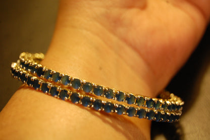 PAIR OF ELEGANT SAPPHIRE BLUE BANGLES