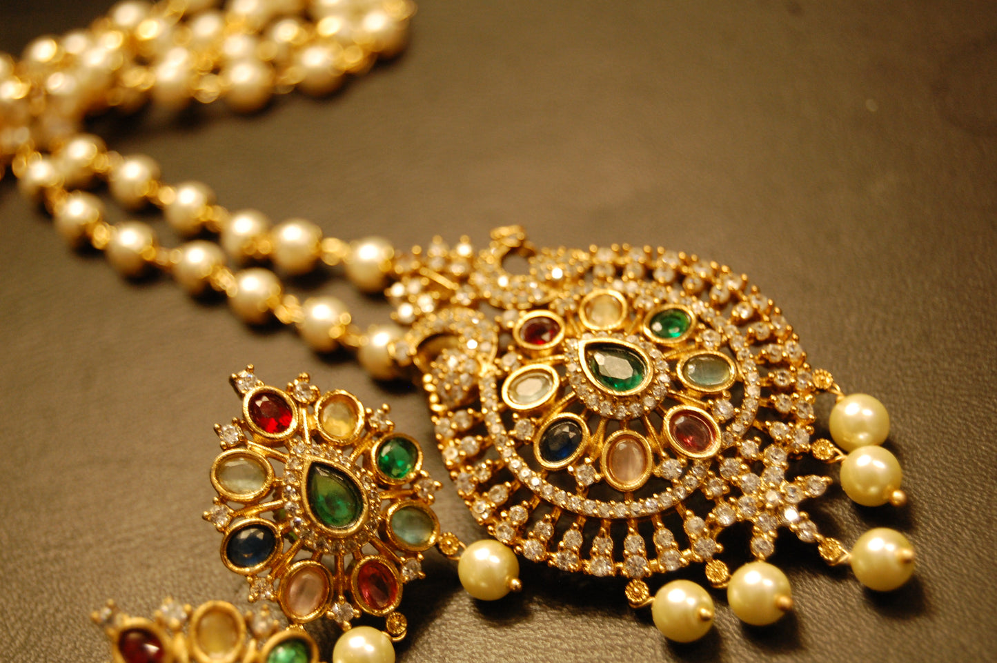 INDIAN MULTI JEWELLED PENDENT IN PEARL STRING