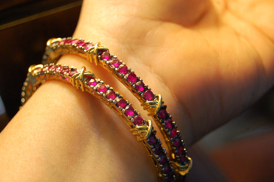 PAIR OF RUBY RED BANGLES (UNOPENABLE)
