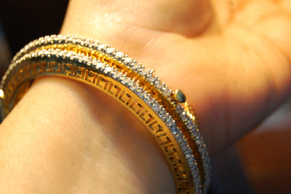 PAIR OF OPENABLE ZIRCON BANGLES