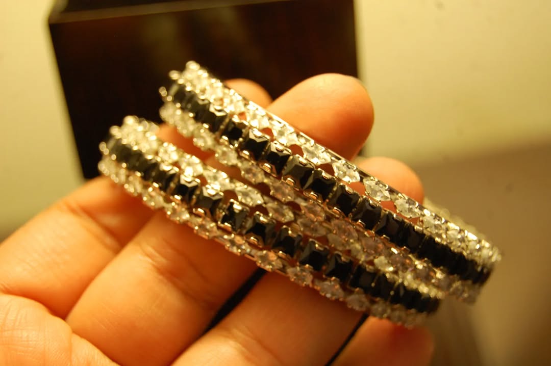 PAIR OF BLACK & ZIRCON BANGLES IN SILVER BASE
