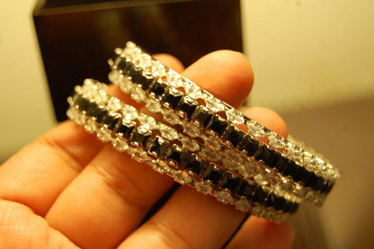 PAIR OF BLACK & ZIRCON BANGLES IN SILVER BASE