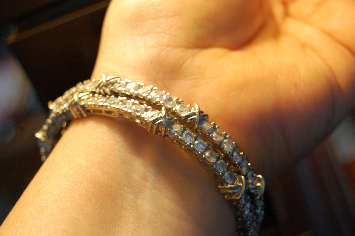 PAIR OF ZIRCON BANGLES (UNOPENABLE)