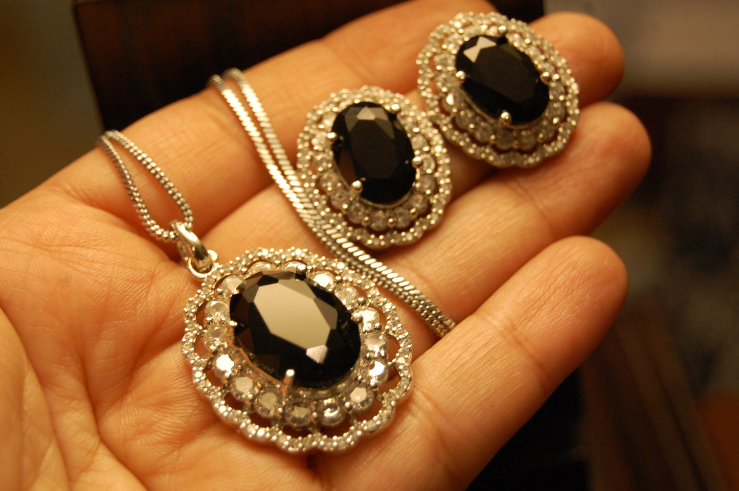 BLACK PENDENT SET IN ZIRCONS