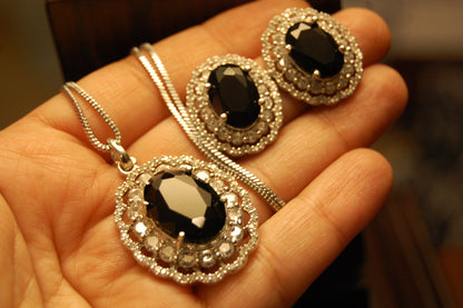 BLACK PENDENT SET IN ZIRCONS