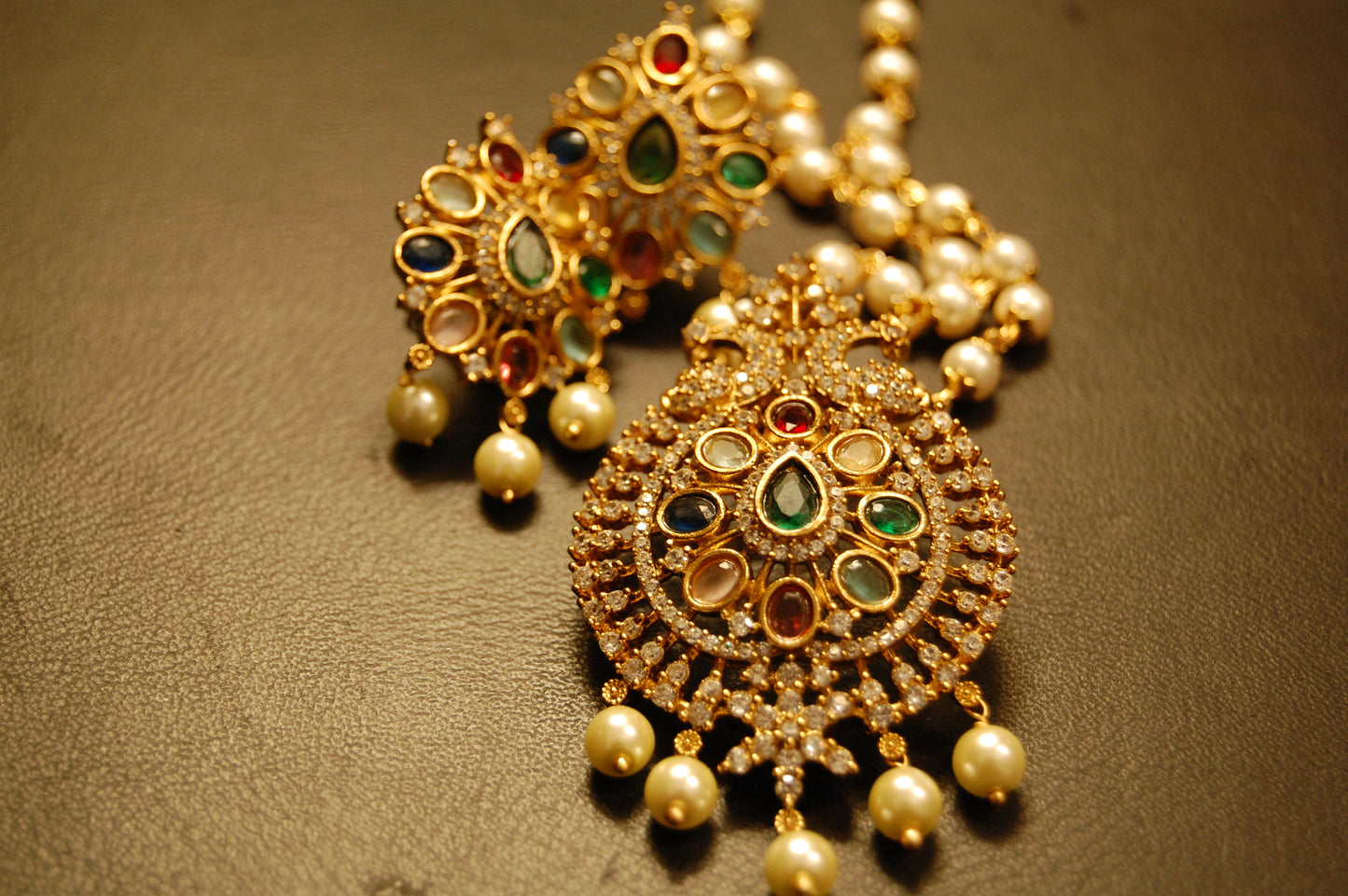 INDIAN MULTI JEWELLED PENDENT IN PEARL STRING