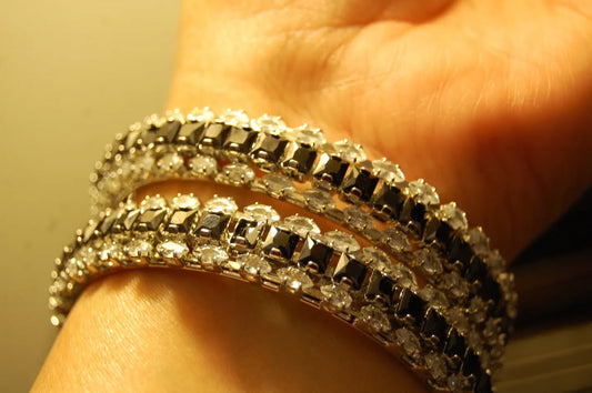 PAIR OF BLACK & ZIRCON BANGLES IN SILVER BASE