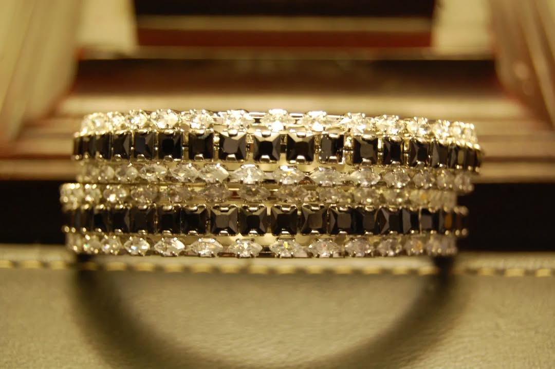 PAIR OF BLACK & ZIRCON BANGLES IN SILVER BASE
