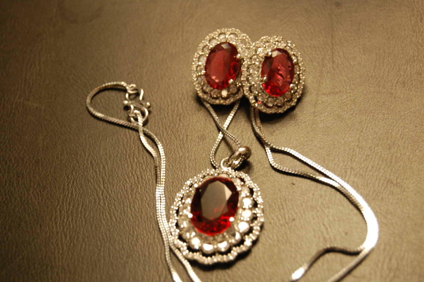 RED PENDENT SET IN ZIRCONS