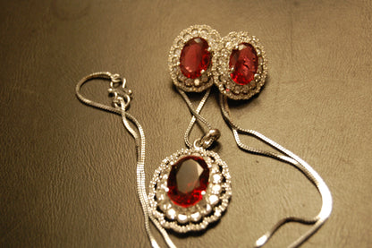 RED PENDENT SET IN ZIRCONS
