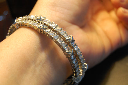 PAIR OF ZIRCON BANGLES (UNOPENABLE)