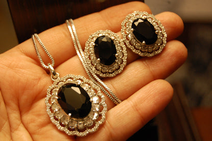 BLACK PENDENT SET IN ZIRCONS