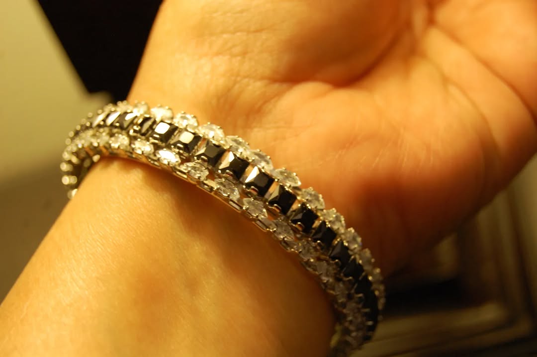 PAIR OF BLACK & ZIRCON BANGLES IN SILVER BASE