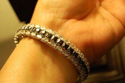 PAIR OF BLACK & ZIRCON BANGLES IN SILVER BASE