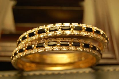 PAIR OF BLACK & ZIRCON BANGLES IN GOLDEN BASE