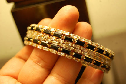 PAIR OF BLACK & ZIRCON BANGLES IN GOLDEN BASE