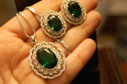 EMERALD GREEN PENDENT SET IN ZIRCONS
