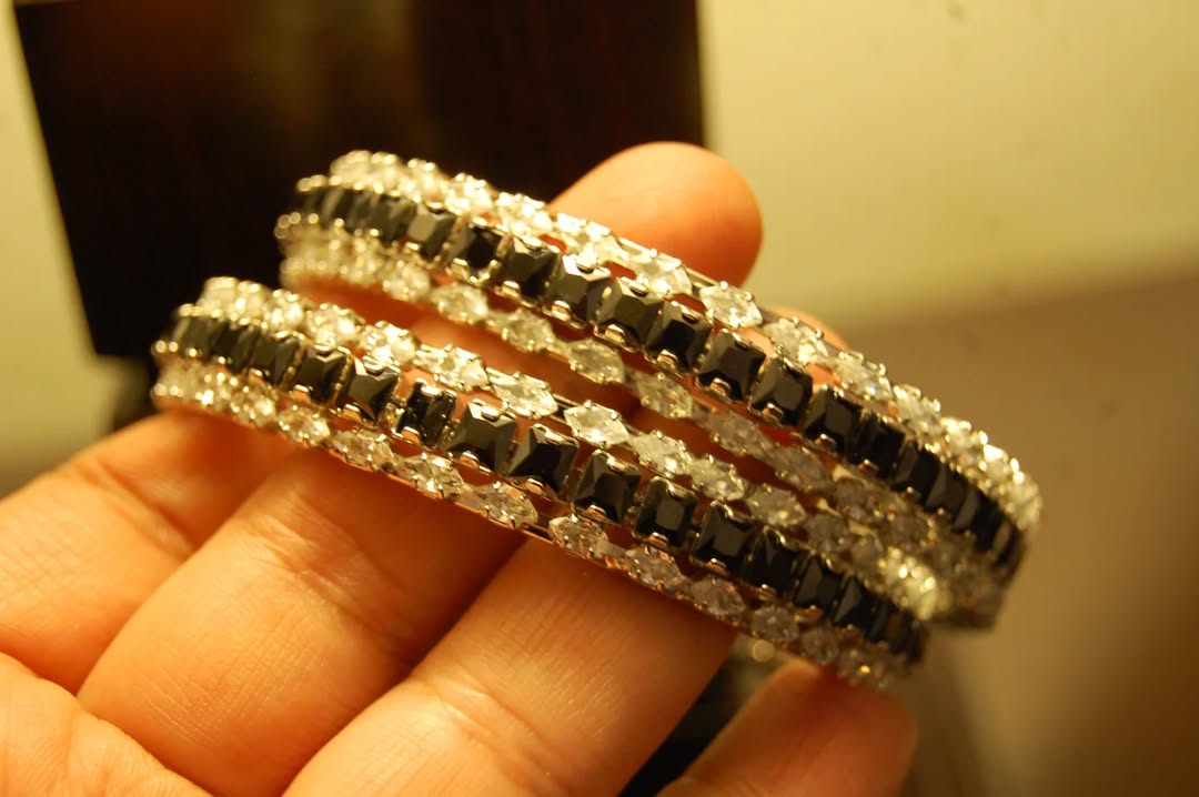 PAIR OF BLACK & ZIRCON BANGLES IN SILVER BASE