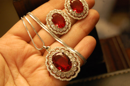 RED PENDENT SET IN ZIRCONS