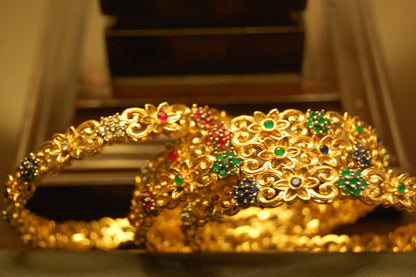PAIR OF MULTI STONE BANGLES