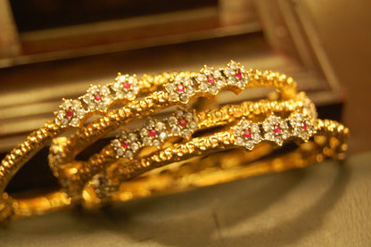 PAIR OF ELEGANT FLORAL RED & ZIRCON BANGLE