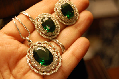 EMERALD GREEN PENDENT SET IN ZIRCONS