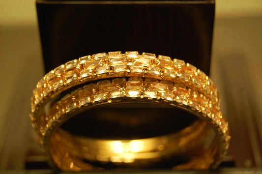 PAIR OF CHAMPAGNE & ZIRCON BANGLES IN GOLDEN BASE