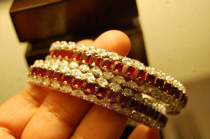 PAIR OF RED & ZIRCON BANGLES IN SILVER BASE