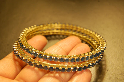 PAIR OF ELEGANT SAPPHIRE BLUE BANGLES