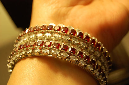 PAIR OF RED & ZIRCON BANGLES IN SILVER BASE