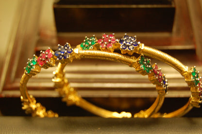 PAIR OF ELEGANT MULTI STONE BANGLES