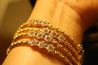 PAIR OF ELEGANT FLORAL RED & ZIRCON BANGLE