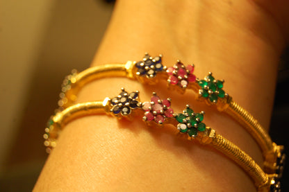 PAIR OF ELEGANT MULTI STONE BANGLES