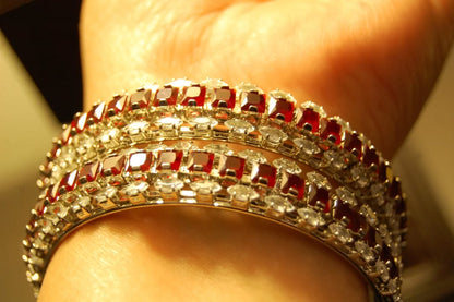 PAIR OF RED & ZIRCON BANGLES IN SILVER BASE