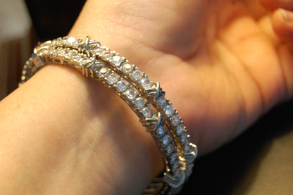 PAIR OF ZIRCON BANGLES (UNOPENABLE)