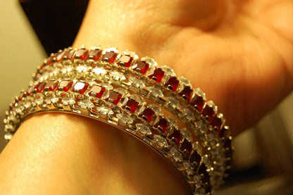 PAIR OF RED & ZIRCON BANGLES IN SILVER BASE