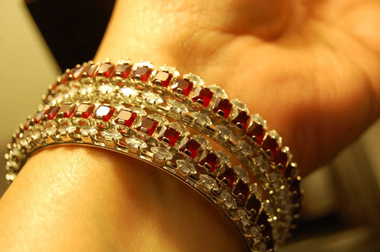 PAIR OF RED & ZIRCON BANGLES IN SILVER BASE