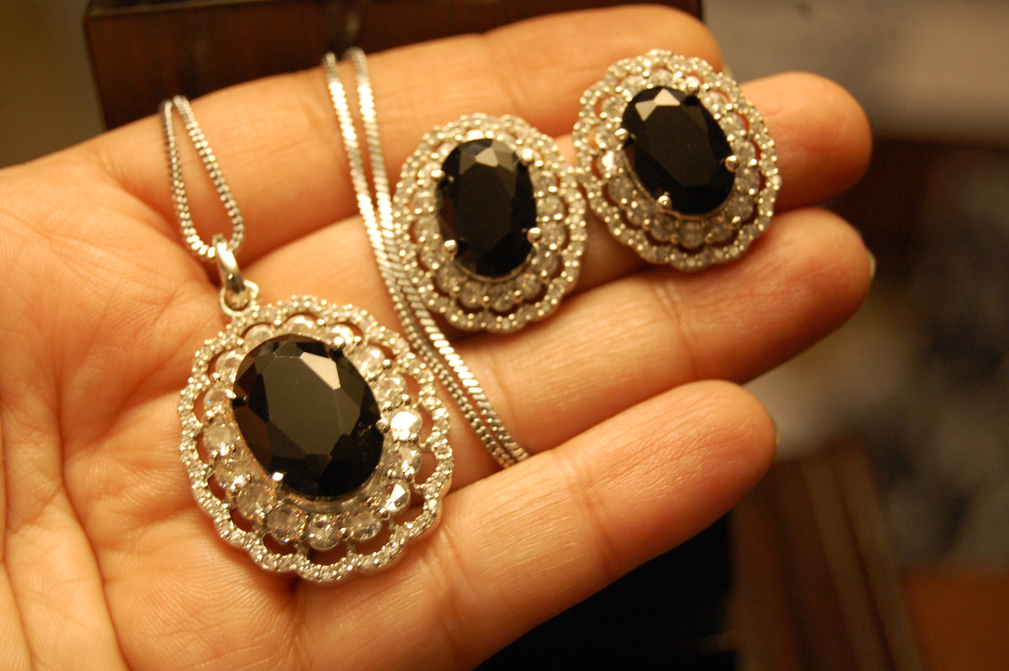 BLACK PENDENT SET IN ZIRCONS