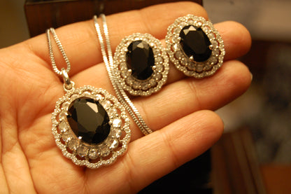 BLACK PENDENT SET IN ZIRCONS