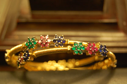 PAIR OF ELEGANT MULTI STONE BANGLES