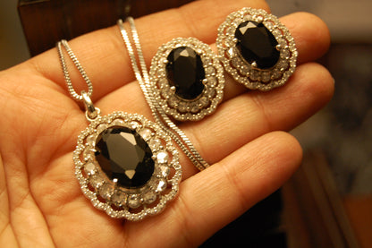 BLACK PENDENT SET IN ZIRCONS